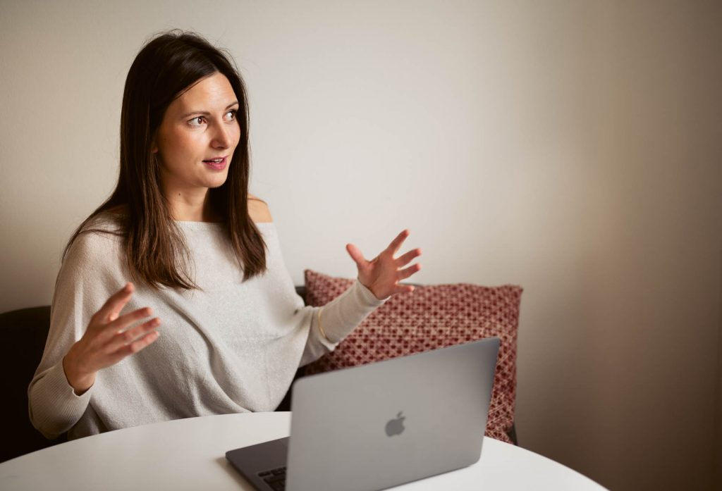 Alja coaching a client online, guiding them through business strategy, pricing, and marketing