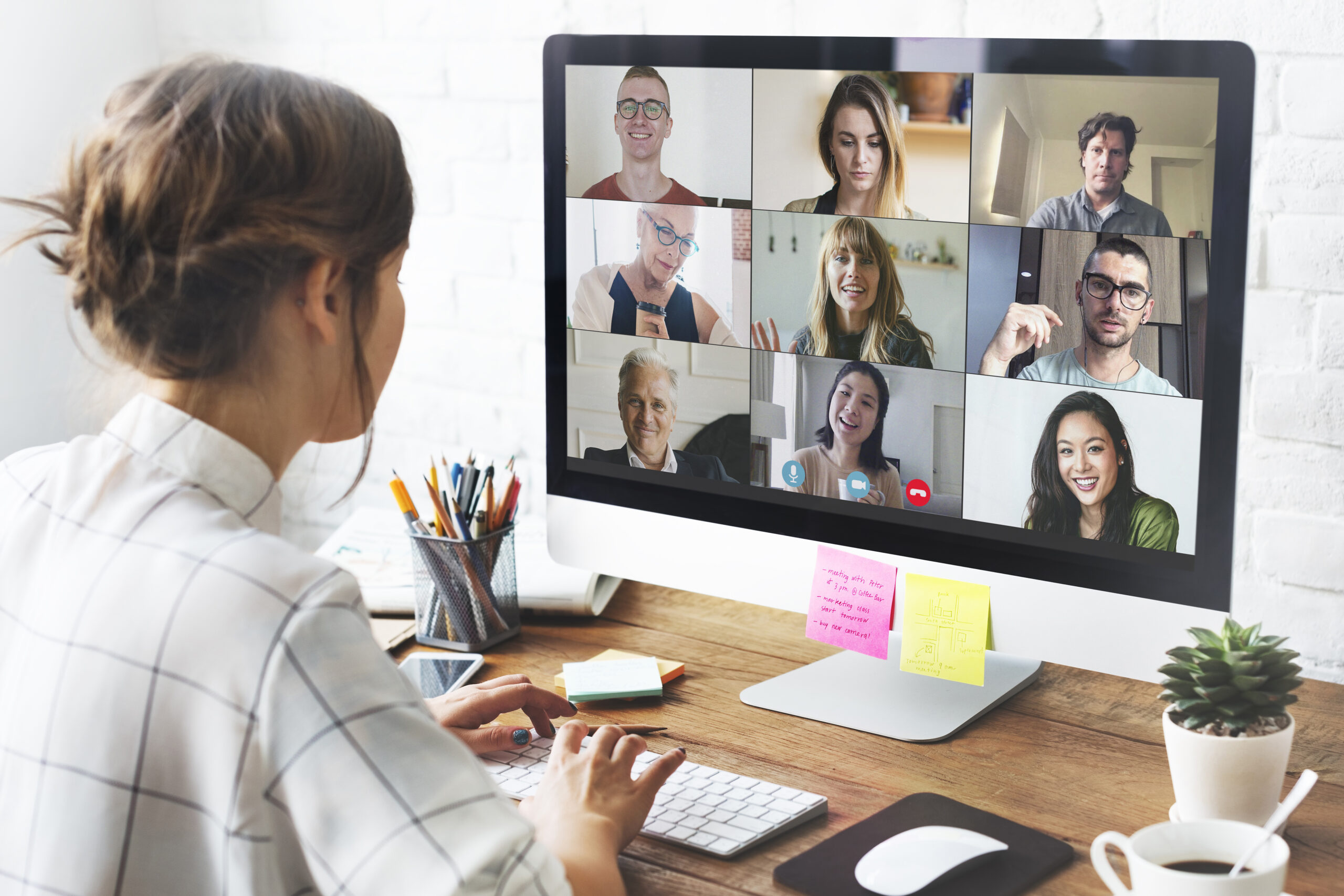 Woman joining a live online session from her home office, representing the Academy's GoBrunch video calls